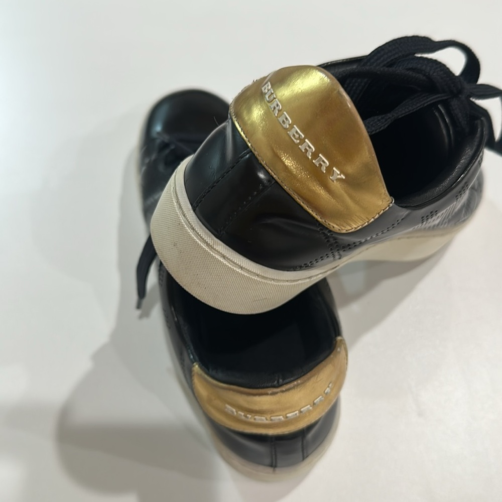 Burberry  sneakers black and  Gold
London England